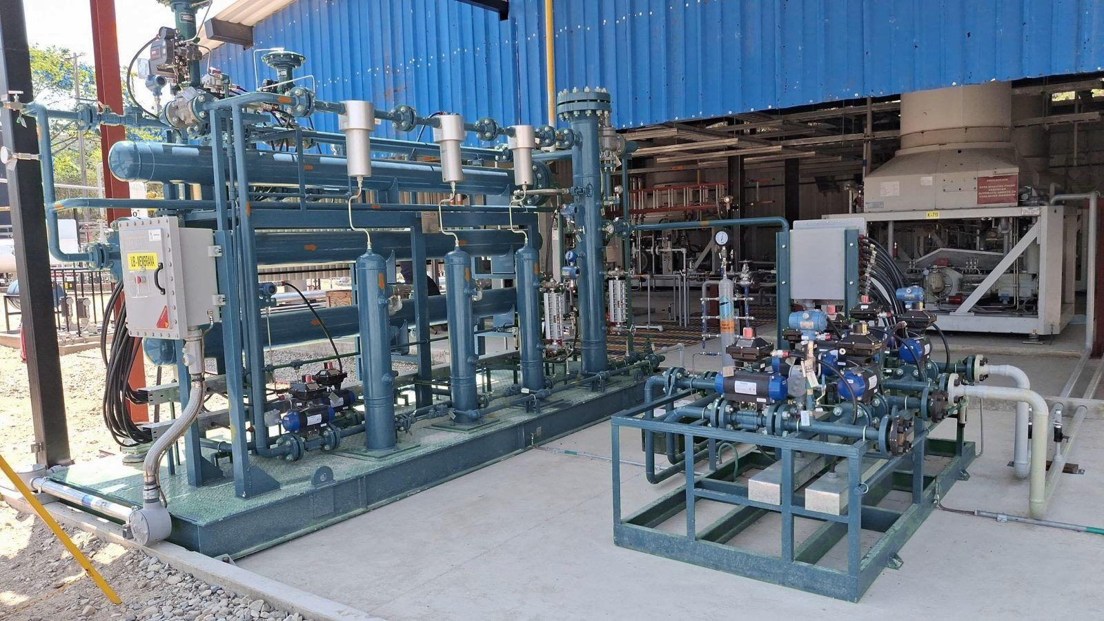 Installed ADV membrane skid with blue valves, sheltered in the field